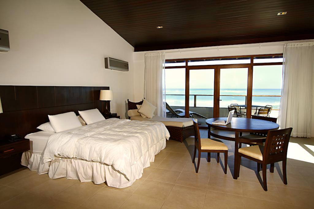 Iguana Crossing Boutique Hotel Puerto Villamil Habitación foto